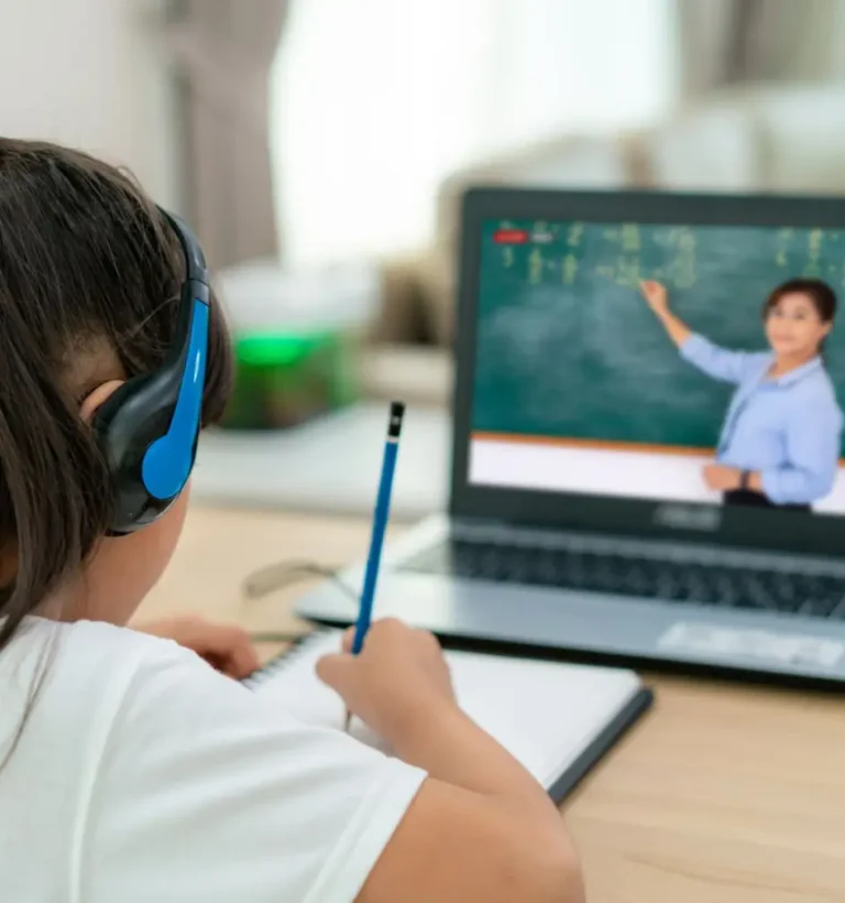 Austrian school tutor taking online math class on the laptop