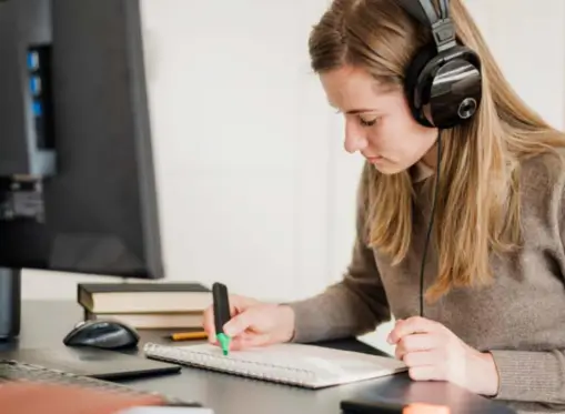 high school math tutor taking online class on the laptop