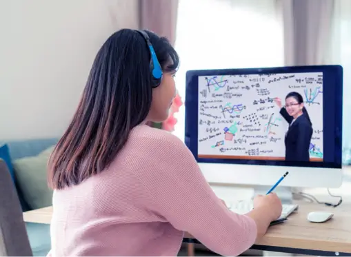 secondary school math tutor taking online class on the laptop