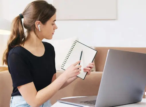 high school math tutor taking online class on the laptop