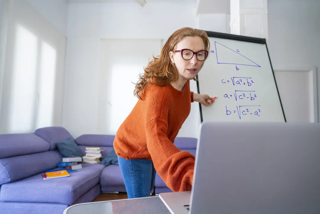 high school math tutor taking online class on the laptop